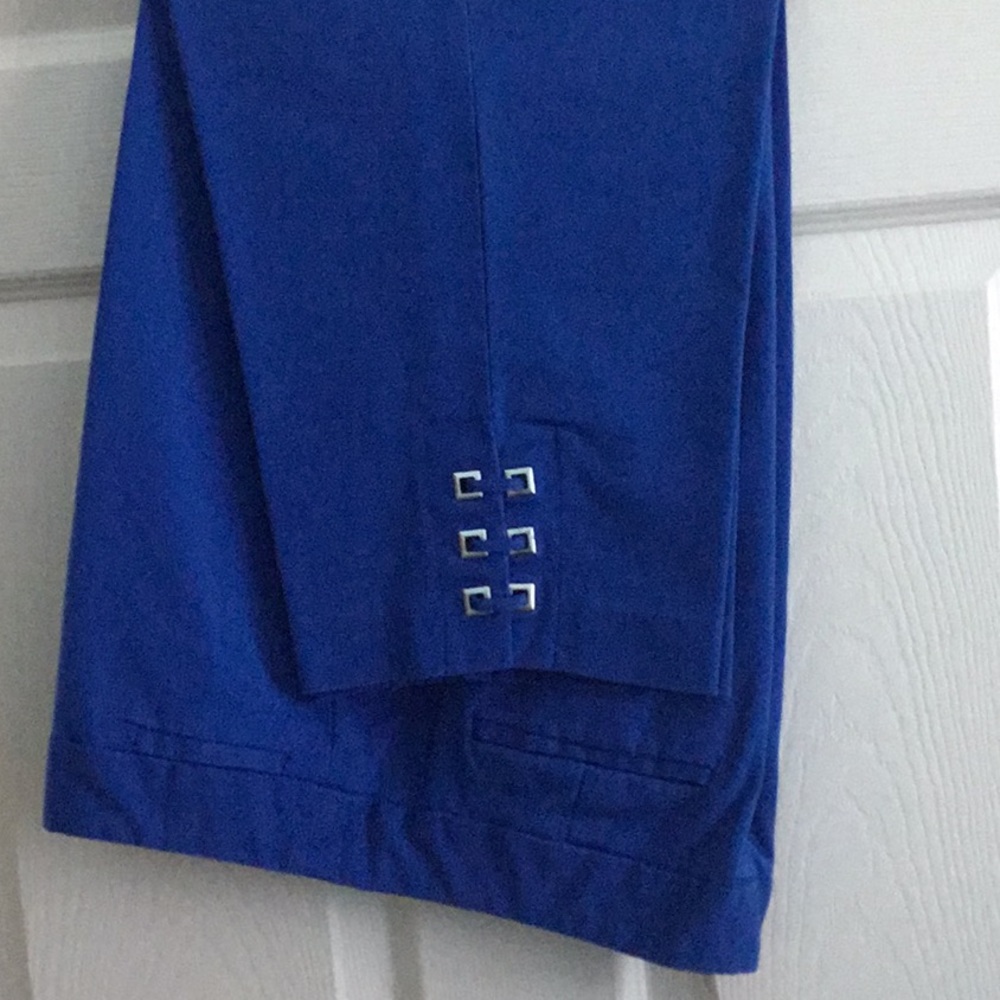 Blue capris with silver accent at calves